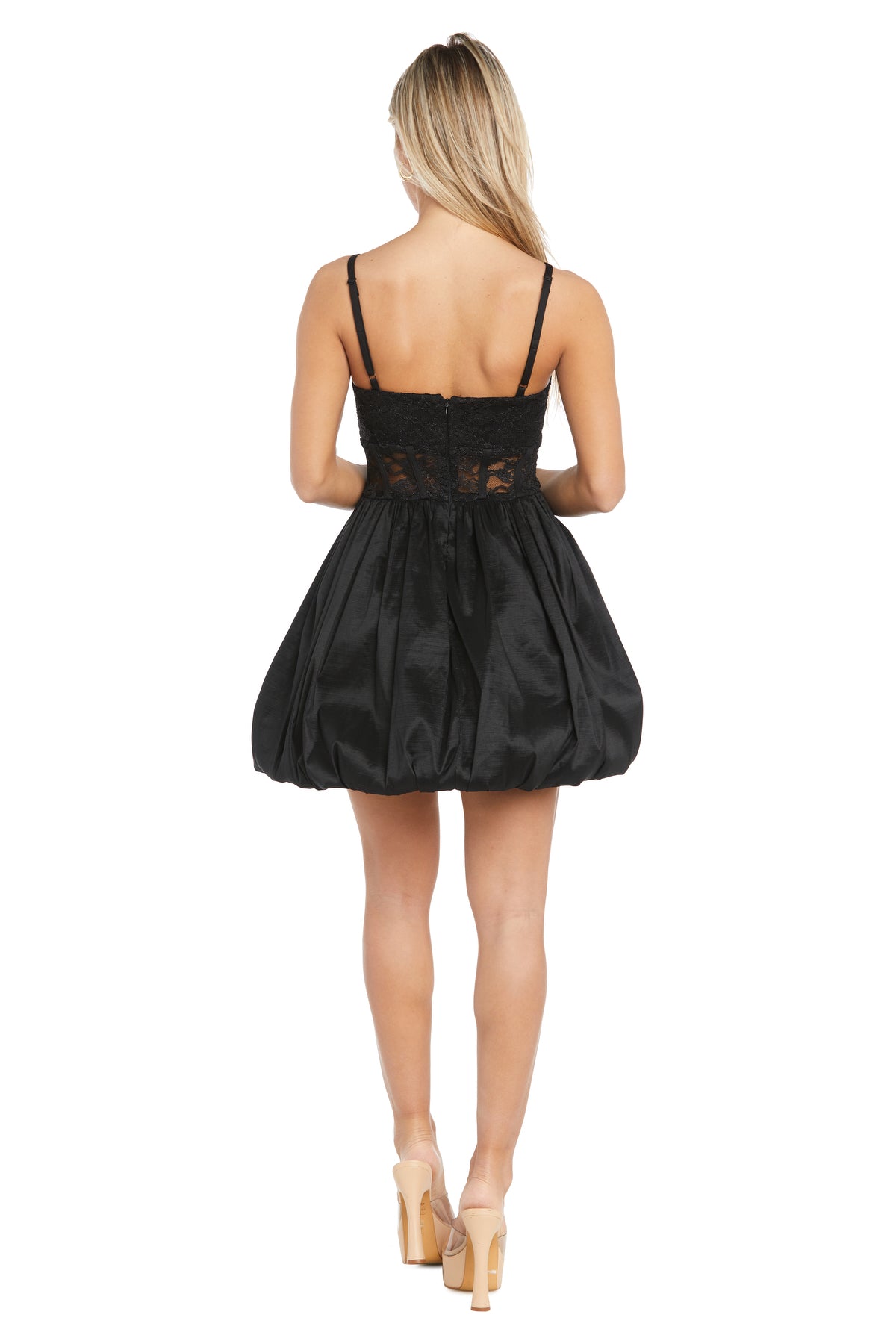 A woman faces away, wearing the Morgan 13298 short black bubble party dress featuring lace details and a voluminous skirt, paired with nude heels—an ideal look for any semi-formal event.